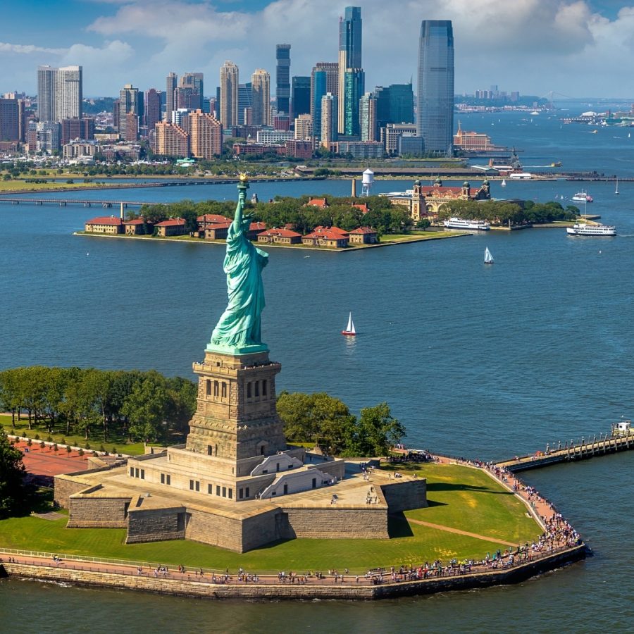 Panoramic aerial view Statue of Liberty and Jersey City and Manhattan cityscape in New York City, NY, USA